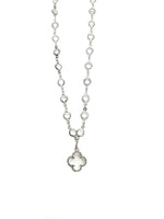 Silver necklace with a clover pendant on a white background