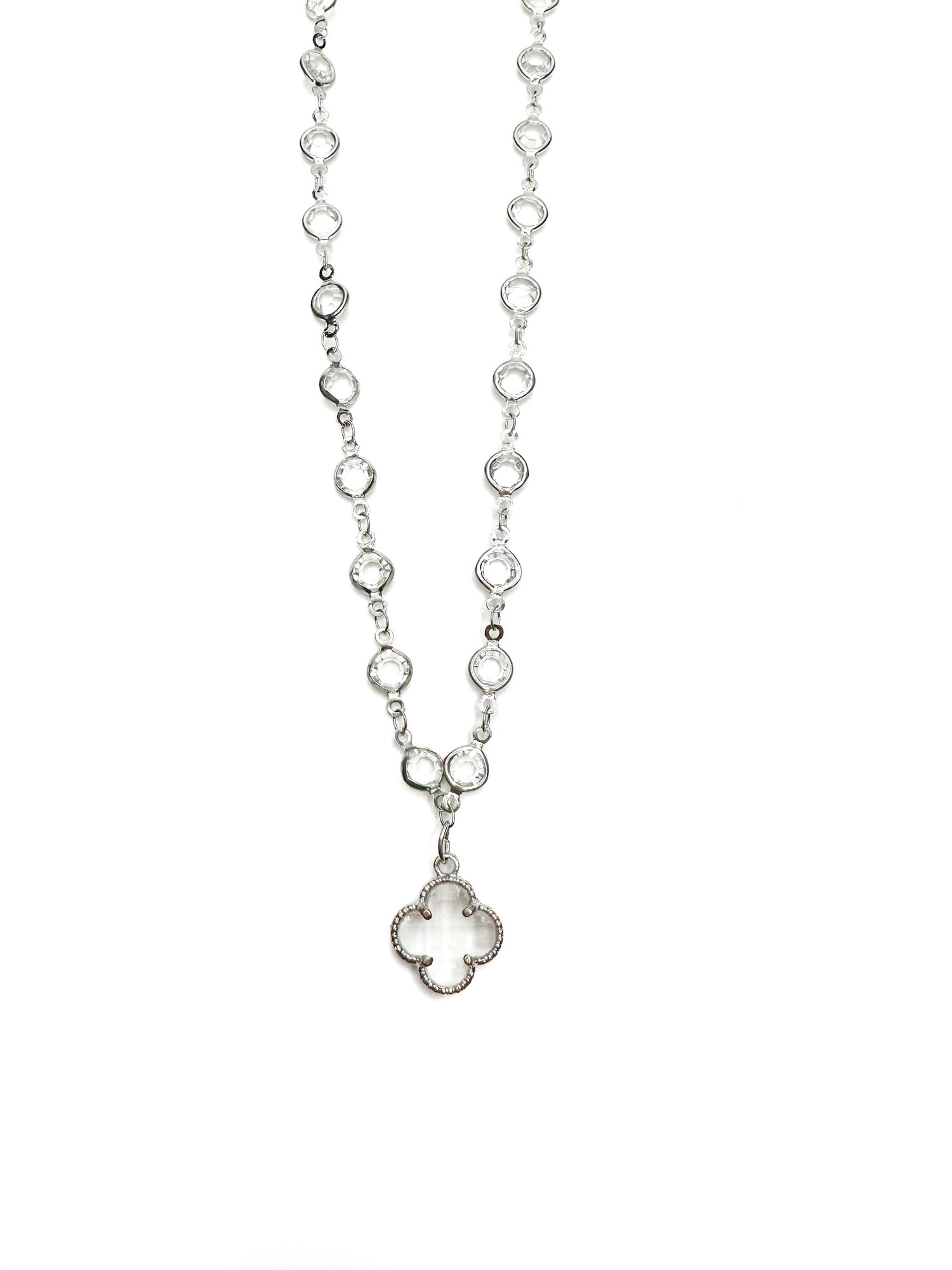 Silver necklace with a clover pendant on a white background