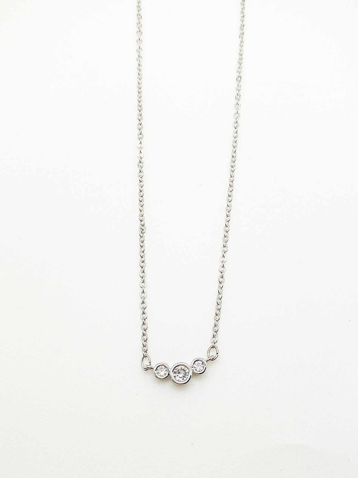 Stacey Necklace in silver with three delicate crystal accents on a fine silver-plated chain at Ardor Boutique.