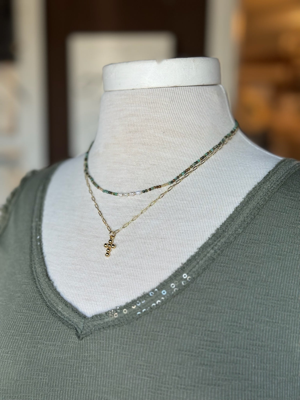 Talia Gold Cross Necklace layered with African turquoise necklace 