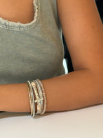 The Marie Blessed Bracelet shown on a models wrist for scale 