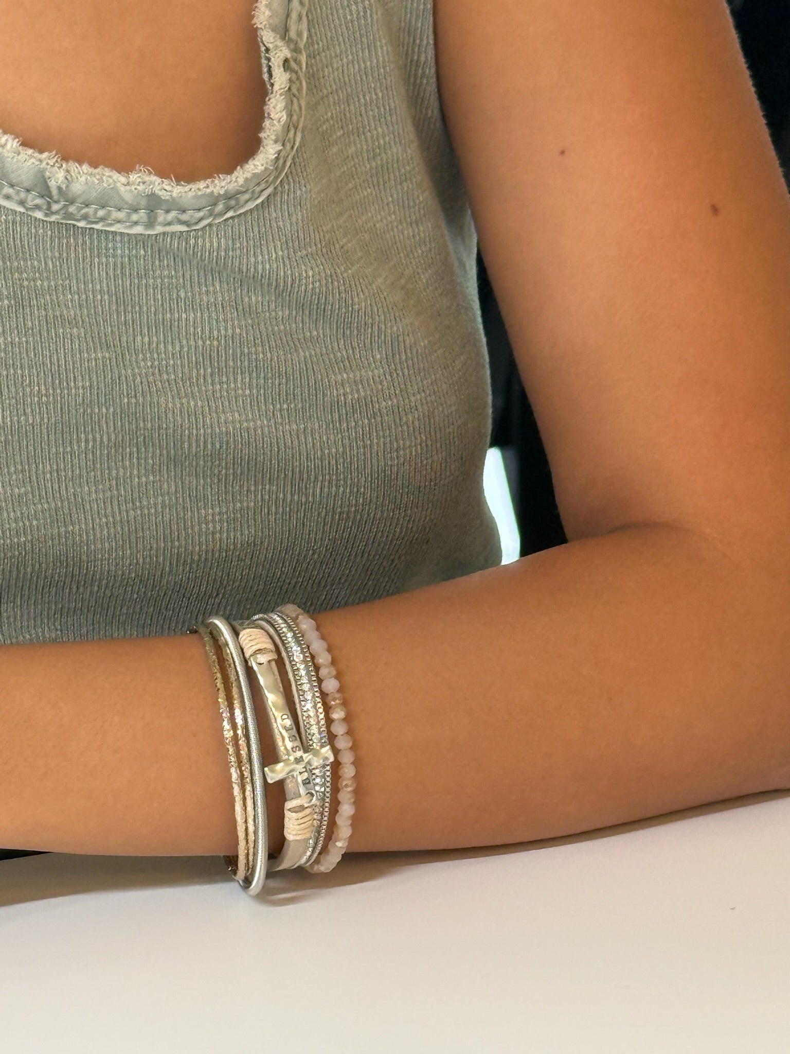 The Marie Blessed Bracelet shown on a models wrist for scale 