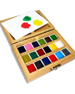 Top view of open bamboo watercolor paint set showing 18 color pans and mixing area in a water resistant deluxe bamboo case paintbrush not included