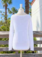 Back view of the white lightweight knit SALTY sweater showing the wide boat neckline, long sleeves, and ribbed hem at Ardor Boutique.