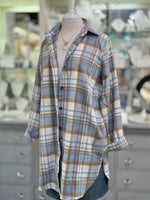 Women’s blue and camel plaid button-down shacket with longline fit.