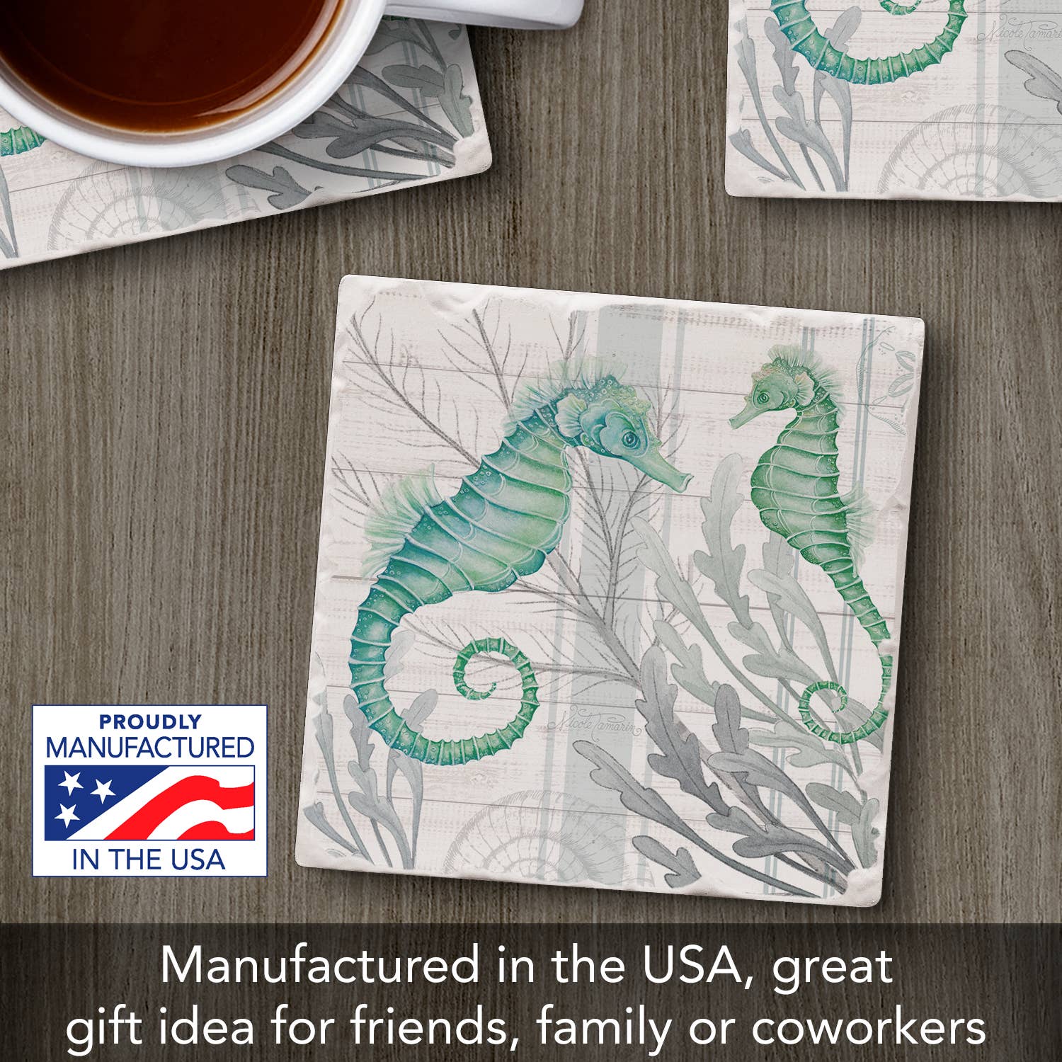 Coaster with seahorse design on a wooden surface with a cup of coffee.