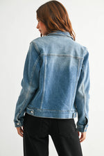 Medium wash denim jacket with buttons  at Ardor Boutique.