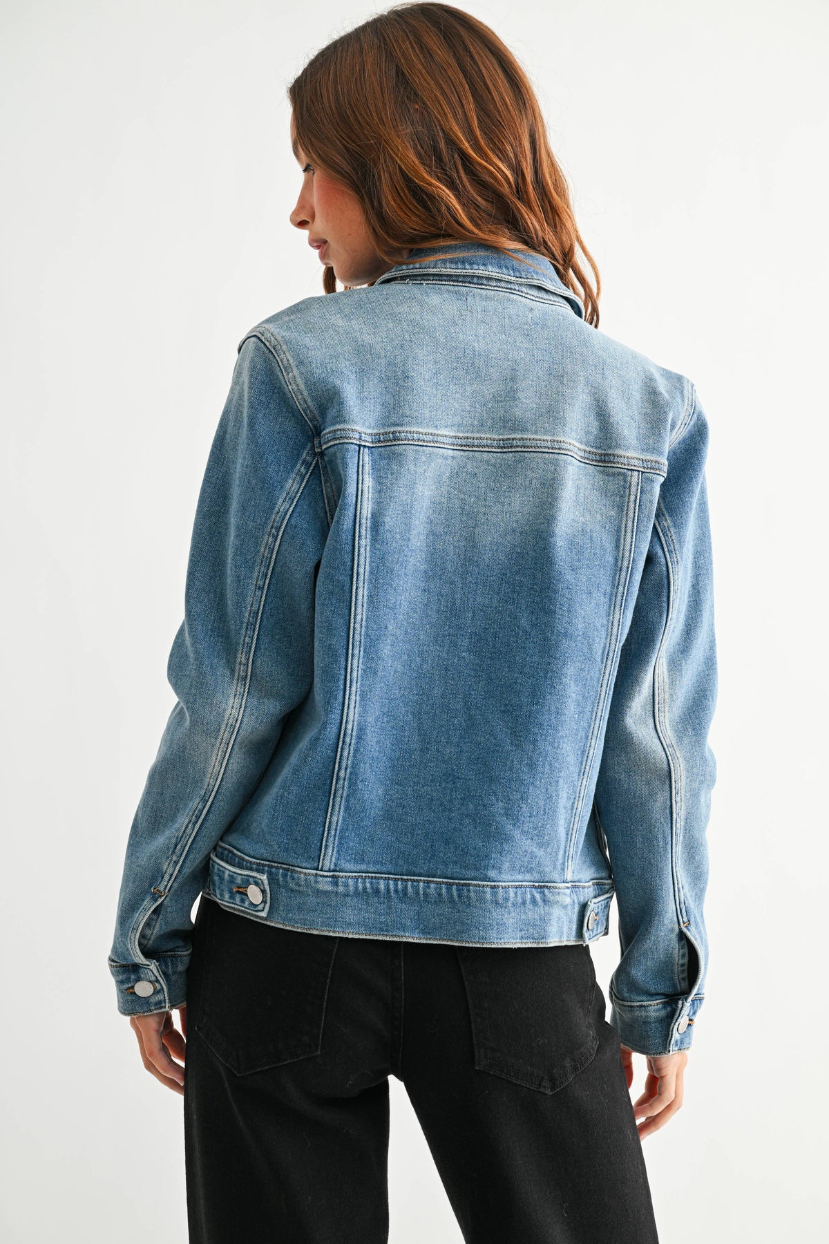Medium wash denim jacket with buttons  at Ardor Boutique.