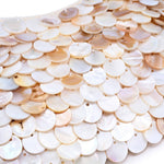 Close-up of layered iridescent shell disc embellishments showcasing the shimmering texture and natural pearlescent finish of the Opalite evening bag. 