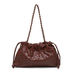 Brown woven handbag with braided handle on a white background