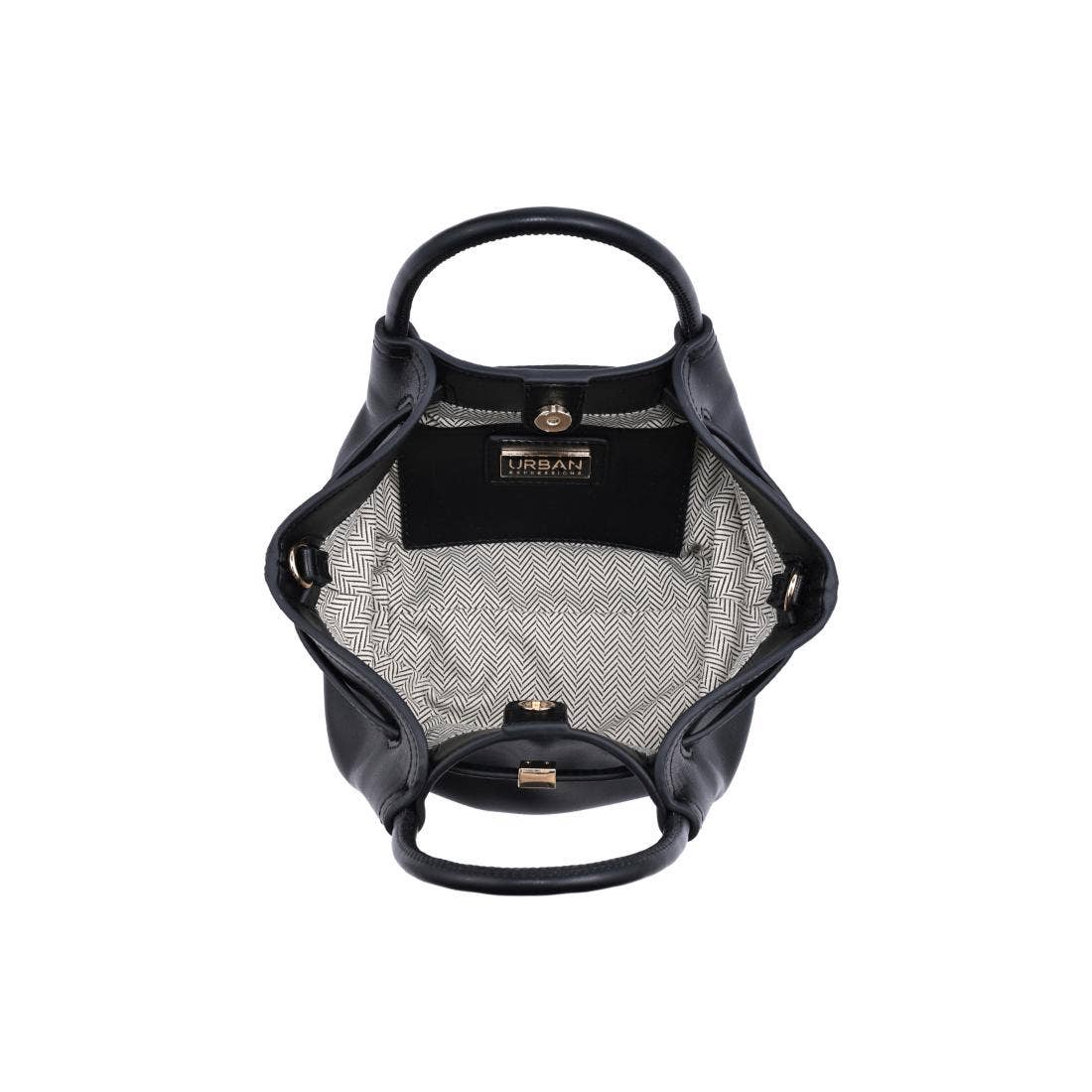 Interior of the Selena Crossbody featuring a herringbone fabric lining, spacious main compartment, interior slip pocket, and magnetic snap closure.