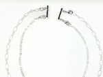 Magnetic silver Layering clasp for necklaces shown in use.