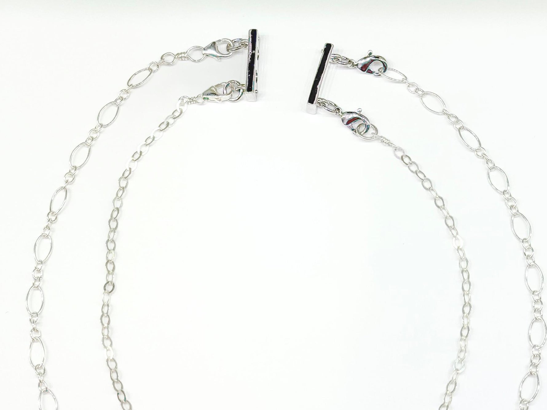 Magnetic silver Layering clasp for necklaces shown in use.