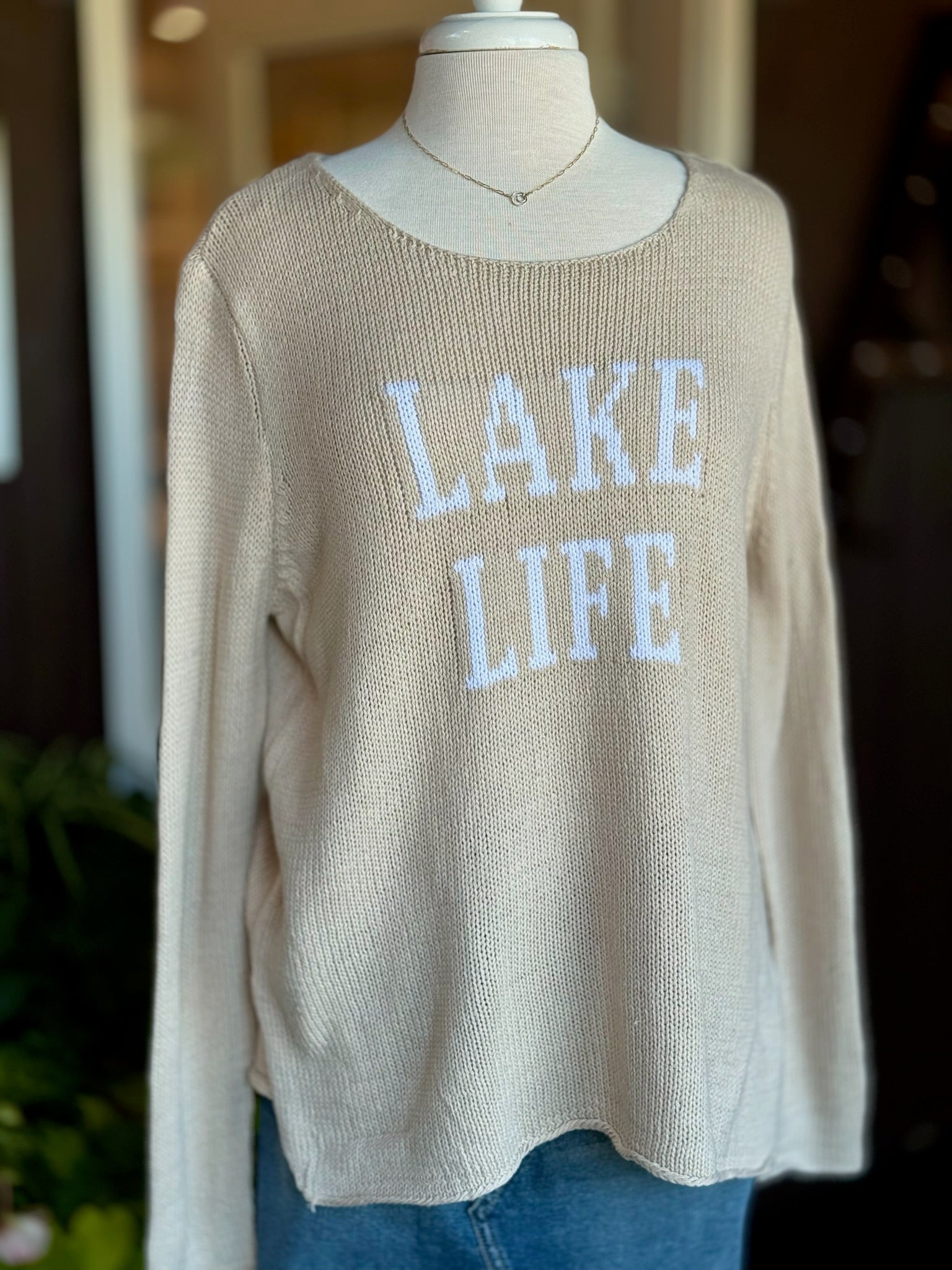 Cotton acrylic tan Lake Life sweater with ivory lettering, front view on mannequin from Ardor Boutique