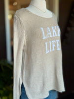 Cotton acrylic tan Lake Life sweater with ivory lettering, angled front view from Ardor Boutique