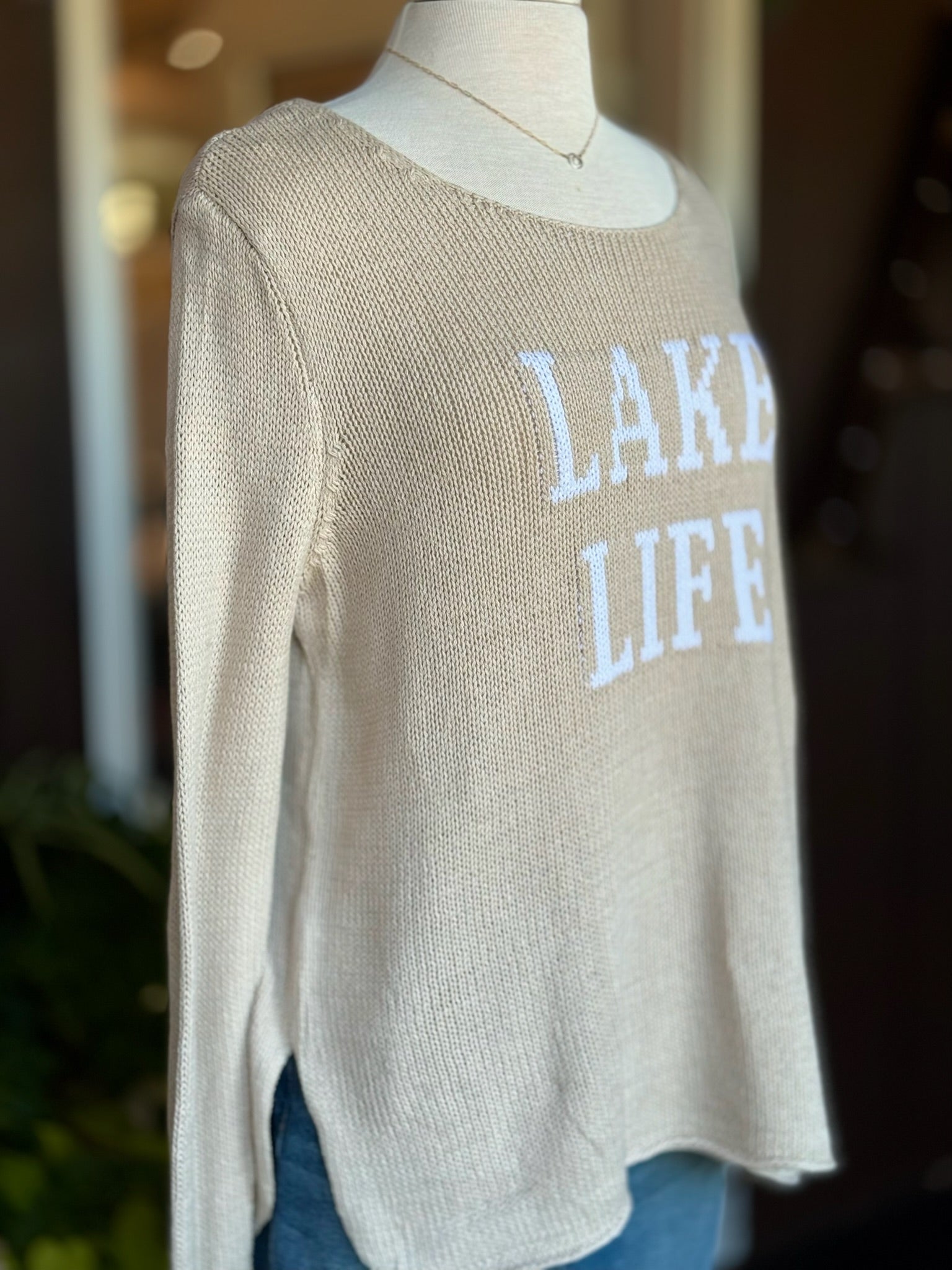 Cotton acrylic tan Lake Life sweater with ivory lettering, angled front view from Ardor Boutique
