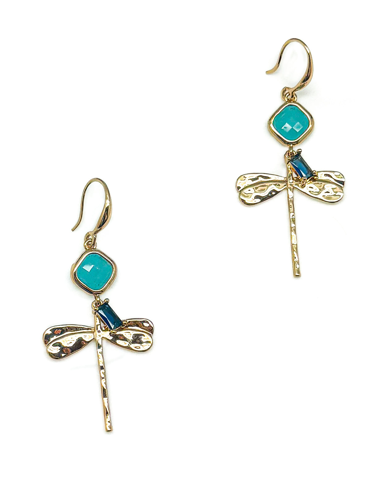 Pair of Lila gold-tone dragonfly drop earrings with aqua stones, navy accents and textured wings on white.