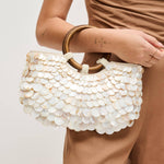 Scarlett Evening Bag featuring layered iridescent shell disc embellishments, polished round wood ring handles with beaded accents, and a removable gold-tone chain shoulder strap.