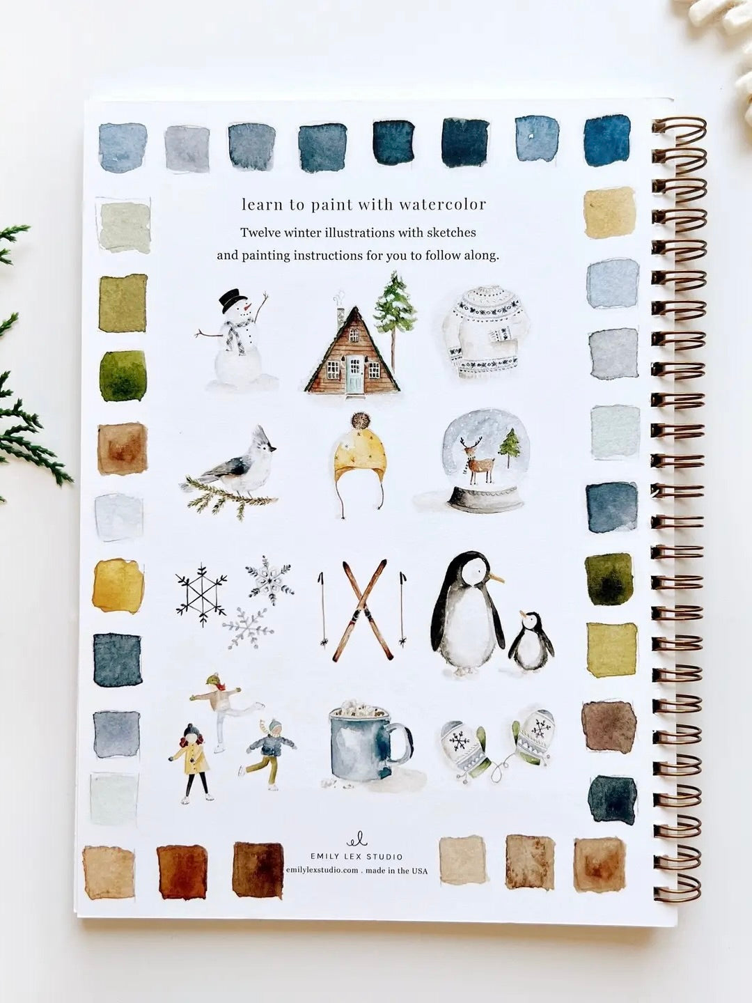 Winter Watercolor Workbook back cover with twelve watercolor illustrations and color swatches, spiral bound by Emily Lex