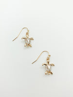 Nylah mixed metal turtle earrings. gold turtles with silver wire wrapping.