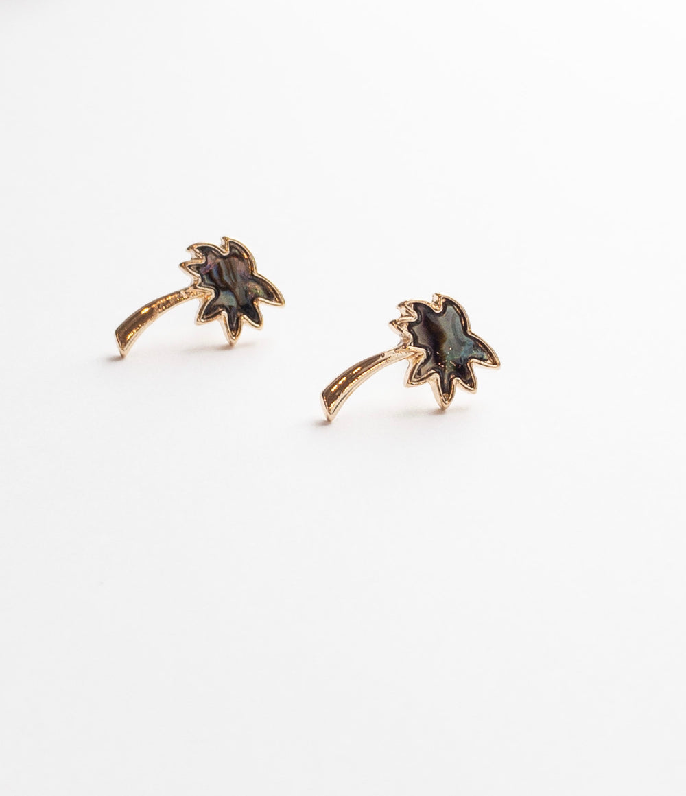 Kai Palm tree studs in gold with abalone center. 