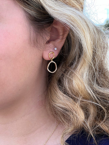 Haylie Duo Earrings in gold on model.